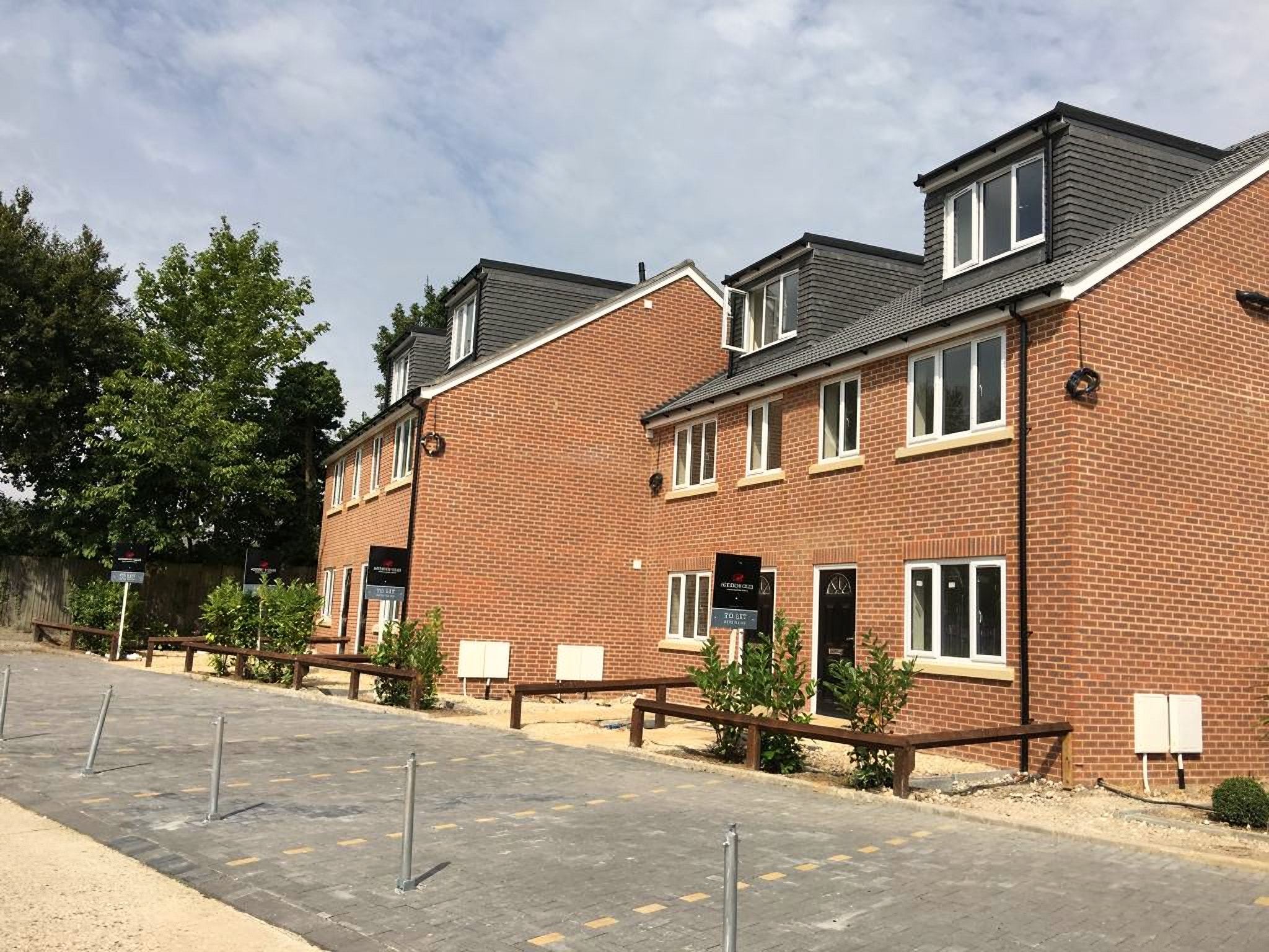 Row of new red-brick semi-detached homes at Brindley Avenue
