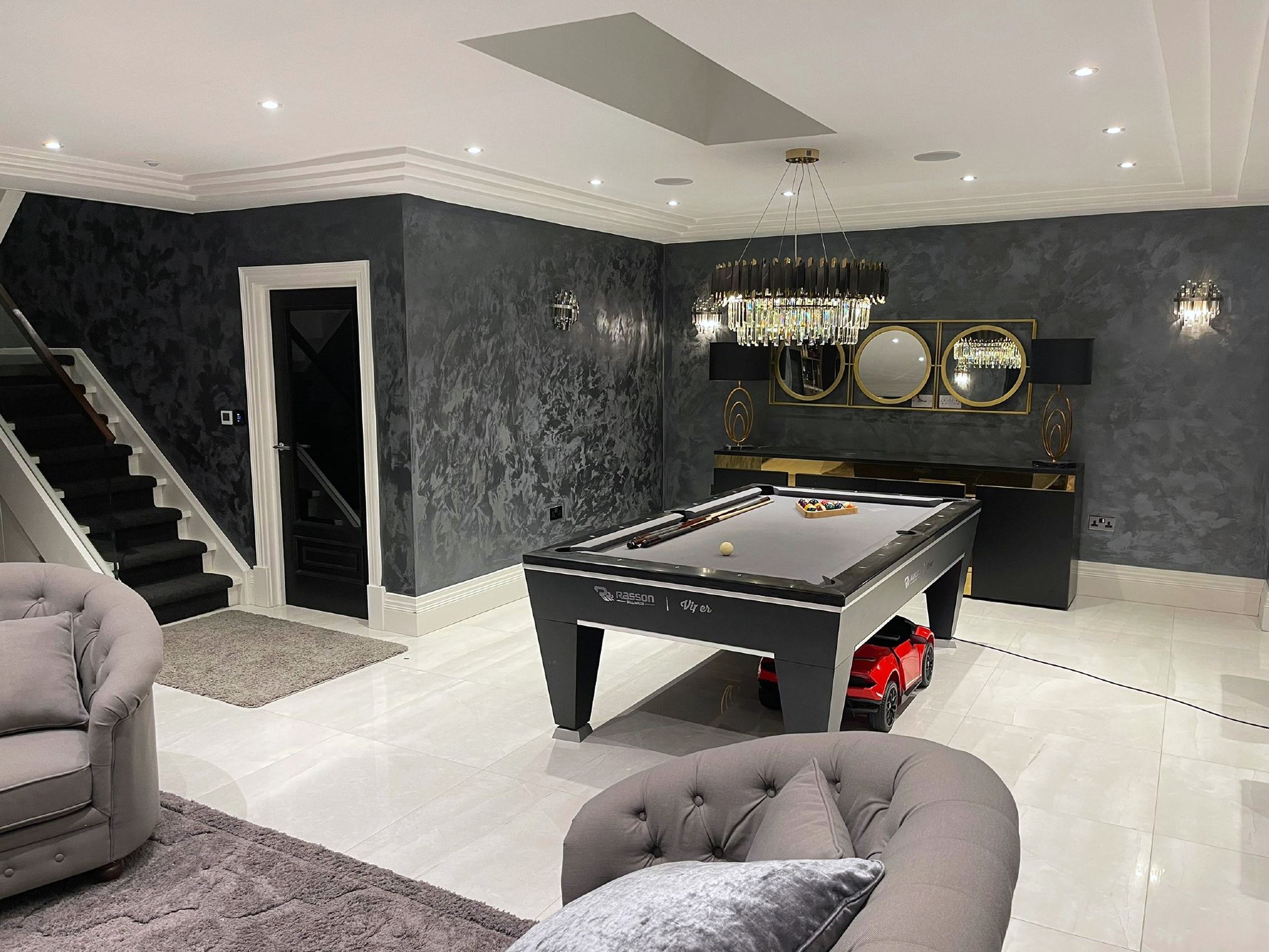 Basement games room with a pool table at Camp Road